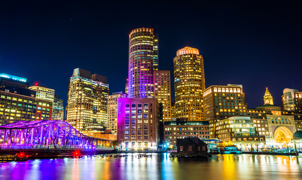 The Boston skyline and Fort Point Channel at night from Fan Pier Park, Boston, Massachusetts.